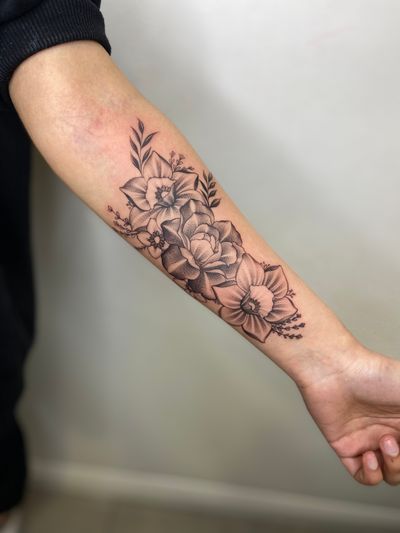 Elegant and detailed floral tattoo in black and gray style, rendered beautifully by talented artist Edyta.