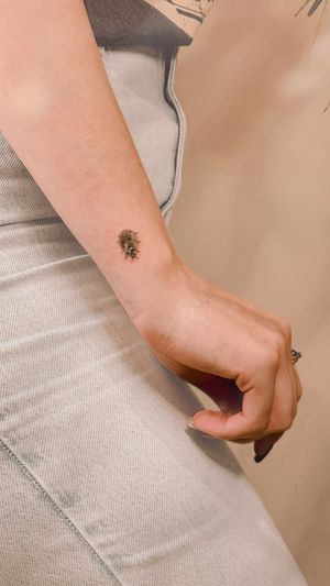 Captivating black and gray microrealism ladybird tattoo by Milky Blue, showcasing intricate details and beautiful shading.