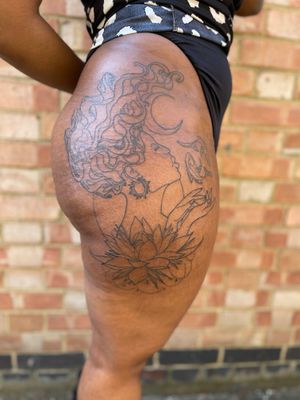 This tattoo represents my client, two fish in a ying and yang position to represent her horoscope sign Pisces, a lotus flower at the bottom as she grew from troubled roots and a crescent moon because why not