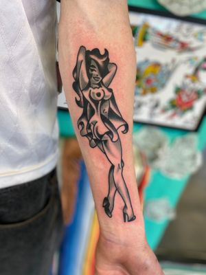 Black and grey pinup lady tattoo 