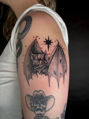 Bold and intricate design by Kat Jennings, featuring a mystical bat and vampire motif. Perfect for lovers of dark and mystical tattoos.