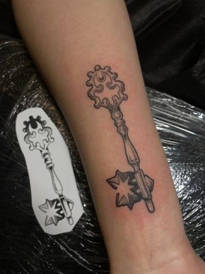 Unlock the beauty of illustrative art with this stunning key tattoo by Kat Jennings. Symbolizing mystery and opportunity, this design is sure to make a bold statement.