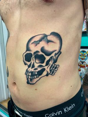 Black and grey traditional skull tattoo 