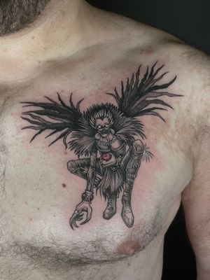 Get a unique tattoo inspired by Death Note with this detailed anime shinigami design by Kat Jennings. Perfect for fans of the series looking for a bold and striking piece of body art.