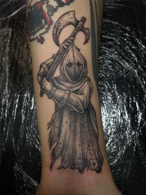 Illustrative tattoo by Kat Jennings featuring a menacing axe-wielding executioner from the medieval era.