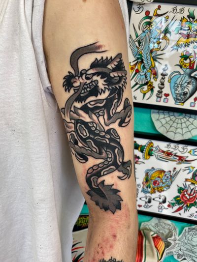Black and grey dragon tattoo