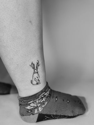 Get a whimsical twist on traditional rabbit tattoo with this unique jackalope design by Ruth Hall.