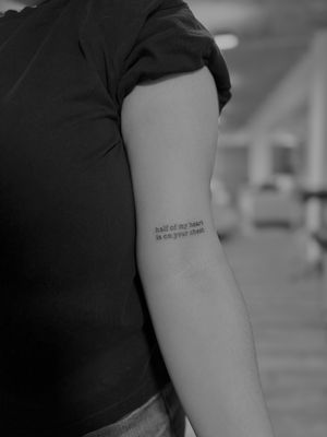 Elegant small lettering tattoo design by renowned artist Ruth Hall, perfect for a subtle yet meaningful ink statement.