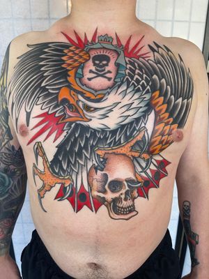 Eagle and skull. The skull and crossbones was existing and incorporated into the design. #colortattoo #traditional #traditionaltattoo #eagletattoo #skulltattoo #eagle #chestpiece #americantraditional