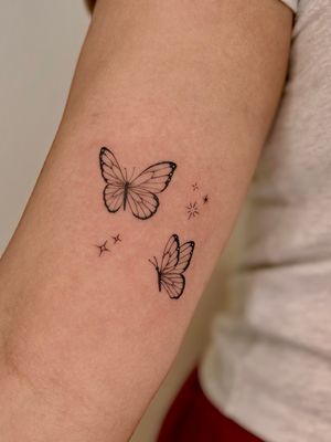 Experience the beauty of nature with this vibrant illustrative butterfly tattoo by the talented artist Ruth Hall.