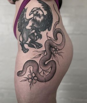 Stunning illustrative tattoo design by Claudia Smith featuring a intricate snake and delicate flower motif.