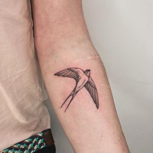 Get a stunning swallow bird tattoo done by Michelle Harrison, expert in illustrative style tattoos.