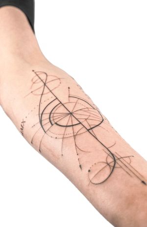 Fine line and illustrative tattoo of a treble clef, designed by Gabriele Edu, with a unique geometric twist.