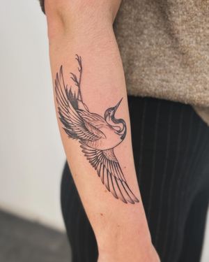 Capture the elegance of a heron in flight with this stunning illustrative tattoo by the talented artist, Paula.