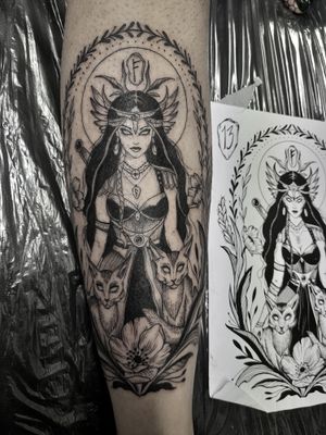 Discover the power of Norse mythology with this unique blackwork tattoo by Elisa Thirteen featuring the goddess Freya and ancient runes.