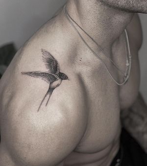 Embrace the beauty of nature with this stunning black and gray illustrative swallow tattoo by HellHabits. Perfect for those who appreciate elegance and grace.