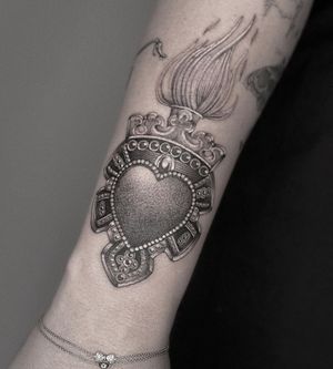 Get a stunning black and gray dotwork sacred heart tattoo with illustrative details by the talented artist HellHabits.