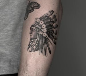 Detailed black and gray illustration of a Native American chief by HellHabits, showcasing intricate micro realism style.