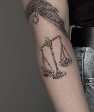 Experience the mystical world of duat with this black and gray micro-realism tattoo by HellHabits. Anubis awaits to guide you through the underworld.