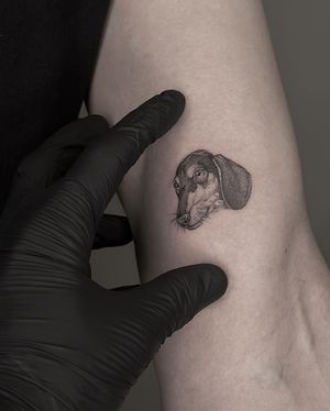 Get a stunning black and gray tattoo of your beloved pet's portrait, expertly done by HellHabits.