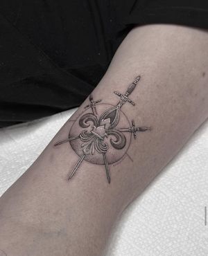 Experience the artistry of HellHabits with this intricate black and gray micro realism tattoo featuring a medieval sword and shield crest.