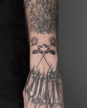Elegant black and gray rose tattoo, expertly crafted by HellHabits, capturing the beauty of nature in a stunning design.