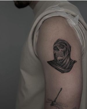 Detailed black and gray micro-realism skull tattoo with an illustrative twist by HellHabits.