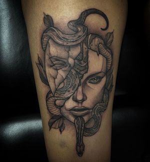 Experience the dramatic allure of a black and gray illustrative snake mask tattoo by Simon Says Ink. Perfect for those seeking a mysterious and theatrical design.