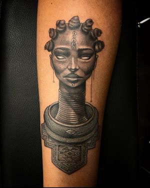 Elegant illustrative tattoo of an African queen by Simon Says Ink, showcasing the beauty and strength of a powerful woman.