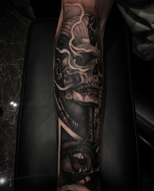 Captivating black and gray illustrative tattoo combining elements of a mummy, pharaoh, and eye by Simon Says Ink.