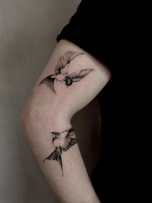 Get inked with a beautifully detailed black and gray swallow tattoo done by the talented artist Saka! Embrace the beauty of nature in this micro realism design.
