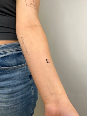 Get intricate and delicate lettering by Emma InkBaby, perfect for minimalistic and subtle tattoo designs.