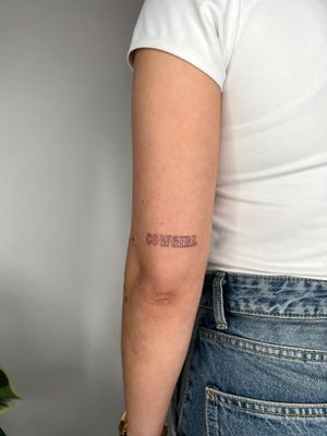 Elegant fine line script tattoo by Emma InkBaby, perfect for those seeking a peaceful reminder in a stylish form.
