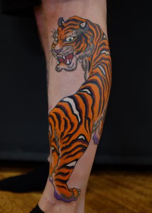 Get a fierce Japanese tiger tattoo with stunning illustrative details by the talented artist Martin Kirke.