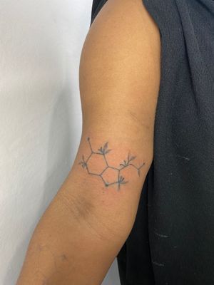 Explore the beauty of fine line and hand poke techniques with this unique tattoo featuring elements, bonds, and vines. By Charlotte Pokes.