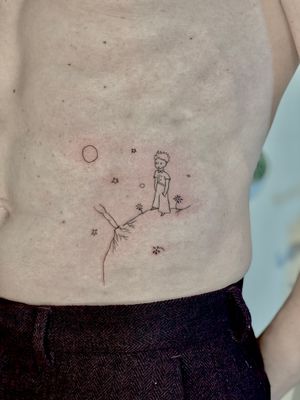 Elegant and intricate fine line illustrative tattoo of The Little Prince, beautifully done by artist Katerina Nireta.