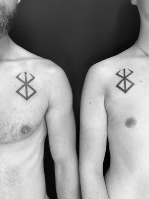 Get inked with Timmy's blackwork interpretation of the symbol from the berserk mark. A bold and powerful design for true fans.