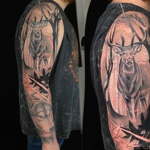Capture the beauty of nature with this stunning black and gray tattoo featuring a deer, wolf, buck, and forest scene by artist Marie Terry.