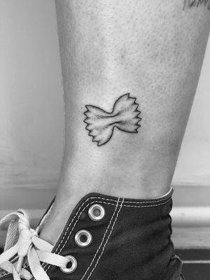 Capture the whimsical beauty of farfalle pasta with this illustrative tattoo by Timmy. Perfect for foodies and pasta lovers!