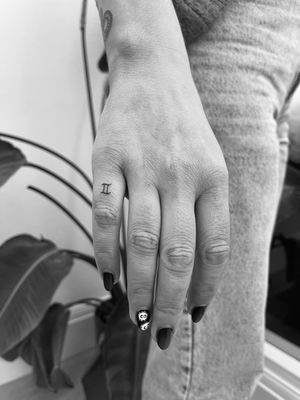 Embrace your Pisces sign with this dainty fine line tattoo by Timmy, perfect for horoscope lovers.