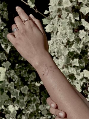 Get a delicate and dainty tattoo by renowned artist Katerina Nireta. This intricate design will surely make a statement.