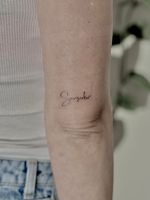 Get a delicate fine line tattoo by Katerina Nireta for a timeless and sophisticated look.