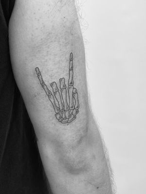 Detailed fine line tattoo by Timmy showcasing a skeletal hand design.