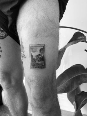 Capture the beauty of Yosemite with this illustrative tattoo by Timmy, featuring a scenic postal stamp design.