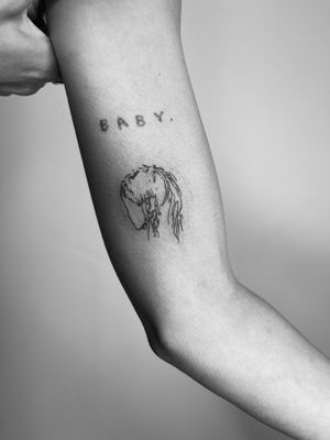 Get a beautifully detailed fine line illustrative tattoo of a girl by the talented artist Timmy.