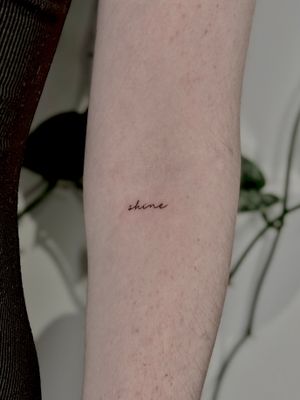 Get inked with delicate small lettering by talented artist Katerina Nireta for a timeless and sophisticated look.