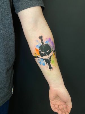 Capture the adventurous spirit of One Piece with this stunning watercolor tattoo by talented artist Marie Terry.