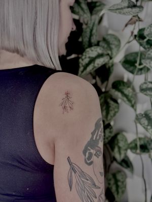 Get inked with a dainty and intricate bundle of flowers by tattoo artist Katerina Nireta. Perfect for those who appreciate fine line and illustrative styles.