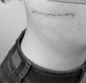 Elegant and intricate small lettering tattoo done in fine line style by the talented artist Timmy. Perfect for those looking for a minimalist yet meaningful design.