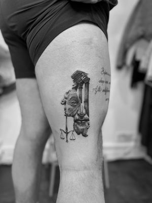 Experience the intricate details of Greek architecture in this black and gray micro-realism tattoo by Rollo, featuring scales, statues, and columns.